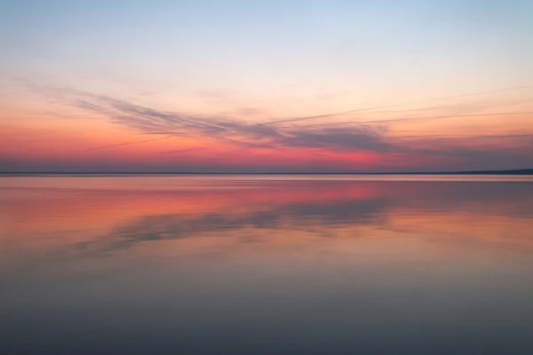 Colorful sunset on the water — Stock Photo, Image