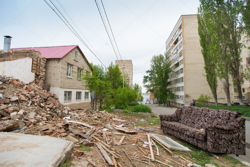 destroyed house in the background of the urban landscape. Saratov, summer 2015