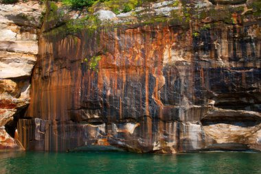 Beautiful mineral deposits on the rocks sandstone, Pictured Rock clipart