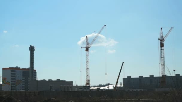 Construction of multi-storey buildings.Cranes work — Stock Video