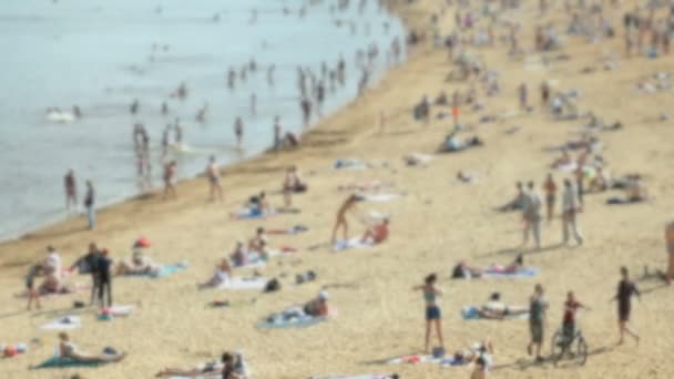 Niewyraźne wideo z bokeh. Ludzi, relaks na plaży — Wideo stockowe