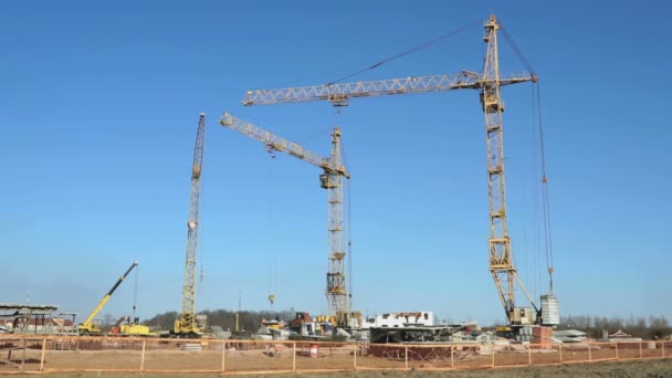 Four construction cranes working on the site — Stock Video