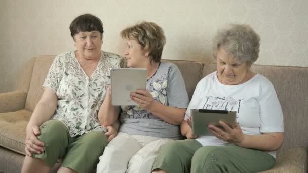 Women holding the silver digital tablets — Stock Video