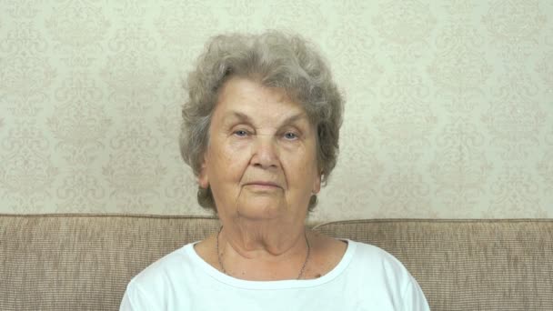 Portrait of serious senior woman with strict look — Stock Video