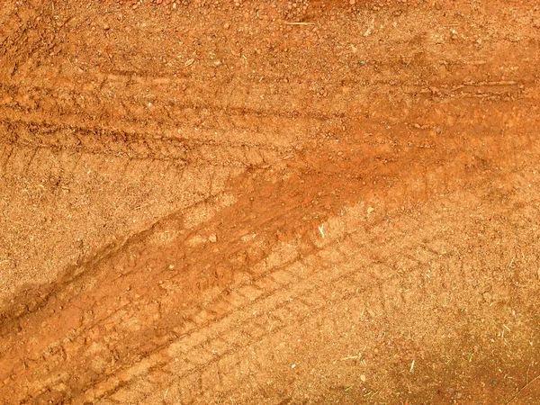 Tire tracks on the road gravel stone background — Stock Photo, Image