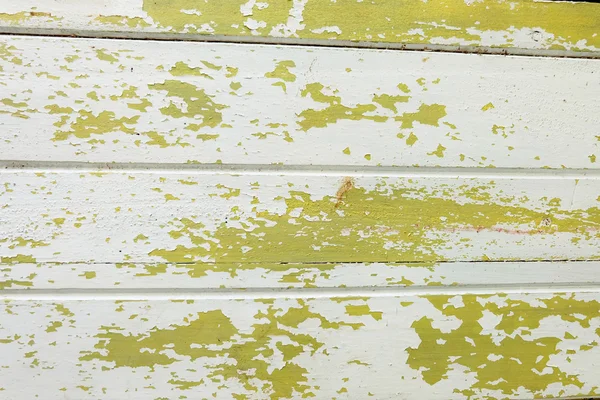De gele verf van woods is peeling uit behang — Stockfoto