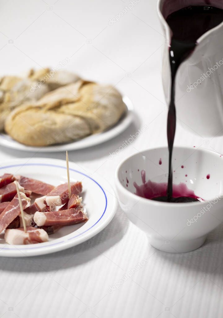 A ham appetizer with the famous and unique Green Red Wine from Minho, Portugal.