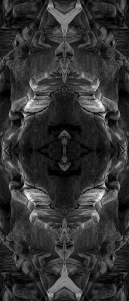 Psychedelic Abstract Faces, made with Sea Rocks, Symmetrical Kaleidoscope Mirror, Abstract Background.