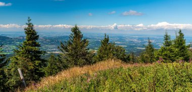Frydek-Mistek, Ostrava and Havirov cities with rural landscape around from Lysa hora hill summit in Moravskoslezske Beskydy mountains in Czech republic during summer day with blue sky and clouds clipart