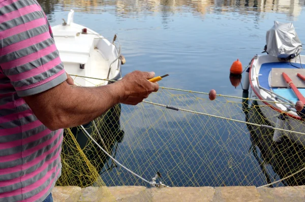 A repair of nets. — Stock Photo, Image