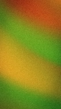 Yeşil, sarı, turuncu ve kırmızı tonlarda canlı bir gradyan ile soyut kumlu arka plan. Sonbahar veya doğa temalı tasarımlar için düşey bulanık bir doku ideali