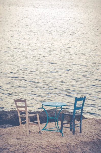 Wooden vintage table set on the sea — Stock Photo, Image