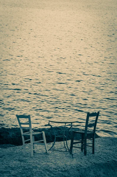 Wooden vintage table set on the sea — Stock Photo, Image