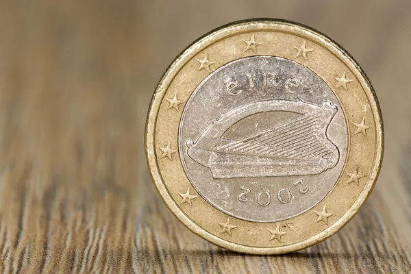 Close up of a one euro coin from the European Union member Ireland showing a picture of the celtic harp