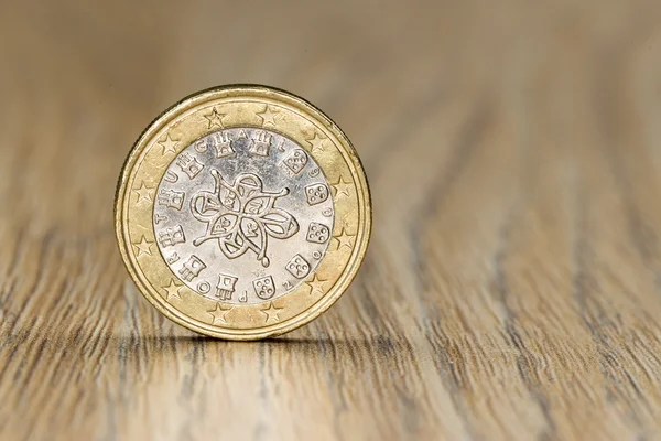 Close up of a one euro coin from the European Union member Portugal showing a picture of the royal seal of 1144