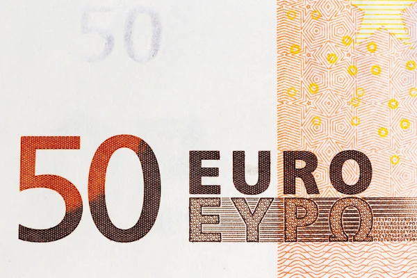 Macro shot of a fifty euro bill showing the words 50 euro