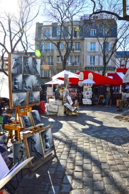 PARIS, FRANCE - APRIL 20, 2015: Paintings sold at Place du Tertre in Montmartre
