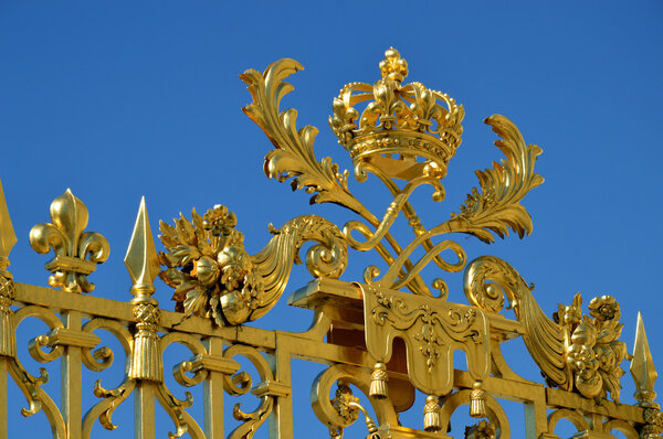 Golden Main Gates of the Versailles Palace. The Palace Versailles was a royal chateau. It was added to the UNESCO list of World Heritage Sites. Paris, France.