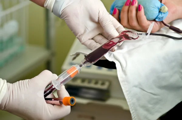 Taking blood from a donor in the test tube Stock Image