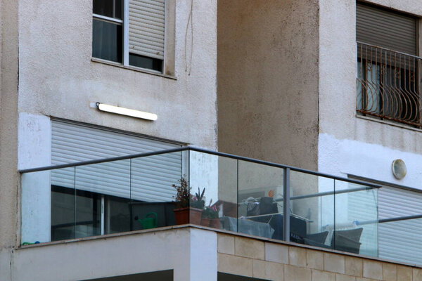 The balcony is an architectural detail of housing construction in Israel. A platform with railings protruding on the upper floors of the building.