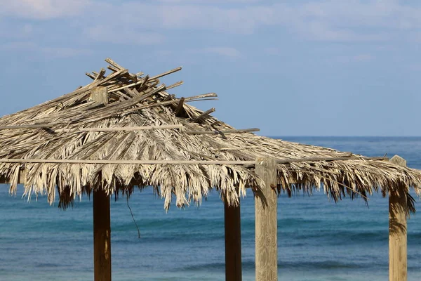 canopy for protection from the sun and outdoor recreation on the shores of the Mediterranean Sea in northern Israel