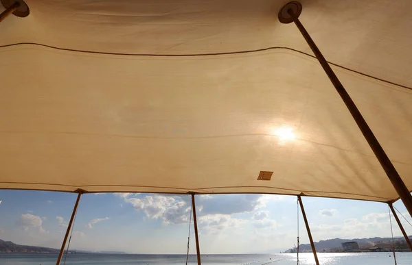 canopy for protection from the sun and outdoor recreation on the shores of the Mediterranean Sea in northern Israel