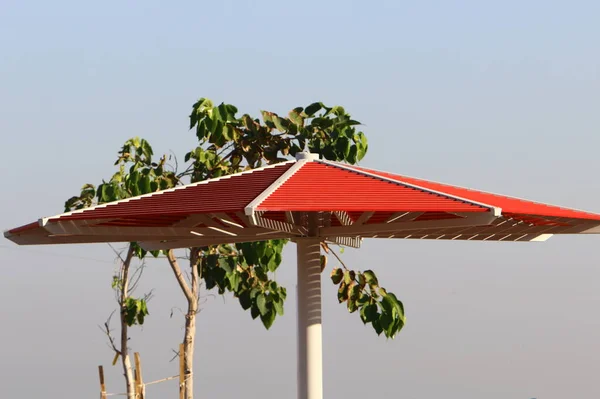 canopy for protection from the sun and outdoor recreation on the shores of the Mediterranean Sea in northern Israel