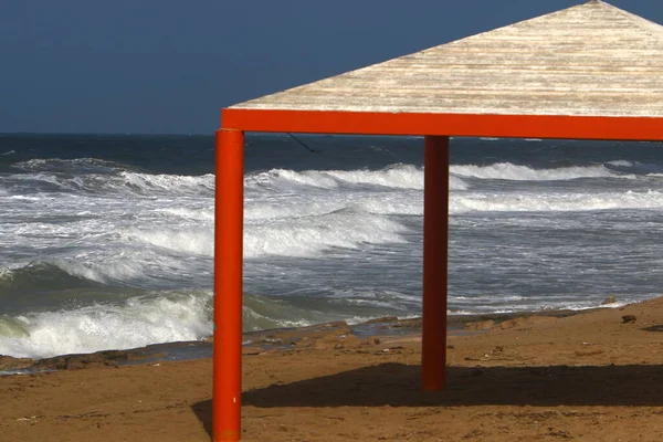 canopy for protection from the sun and outdoor recreation on the shores of the Mediterranean Sea in northern Israel