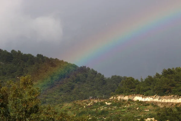 double rainbow in the mountains above the forest after rain in northern Israel