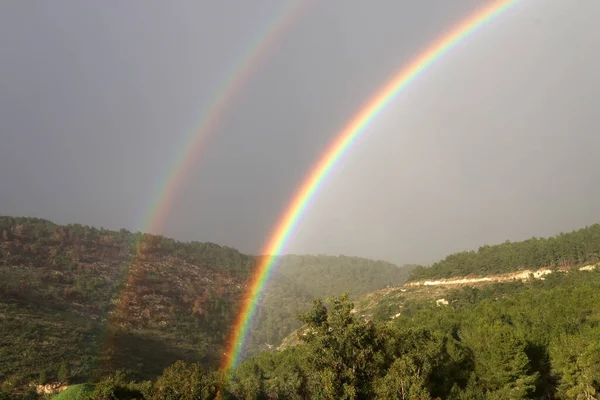 double rainbow in the mountains above the forest after rain in northern Israel