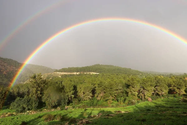 double rainbow in the mountains above the forest after rain in northern Israel