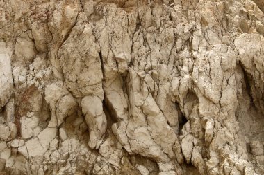 İsrail 'in güneyindeki Judean Çölü' ndeki dağ yamaçlarının ve manzaraların dokusu. Çölde güneşli sıcak bir gün. 