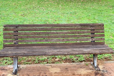 A bench for relaxation stands in a city park on the shores of the Mediterranean Sea on the Sesere of Israel 