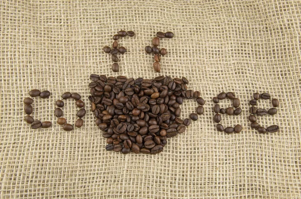 Bir fincan kahve kavrulmuş fasulye — Stok fotoğraf