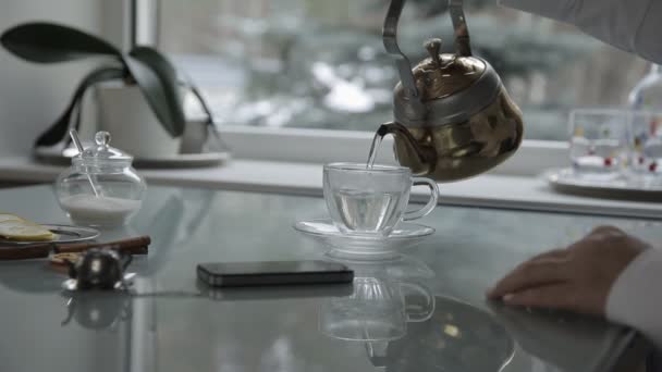 Morning. breakfast. hand pours tea — Stock Video