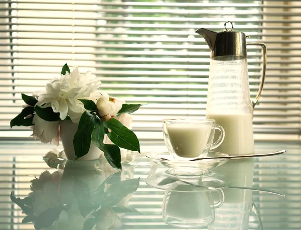 Summer Still Life with Jug, cup and peonies on a glass table — Stok Foto