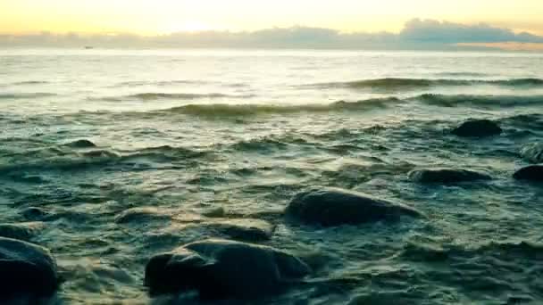 Tidal bore. Boat floats on the background of the rising sun and clouds — Stock Video