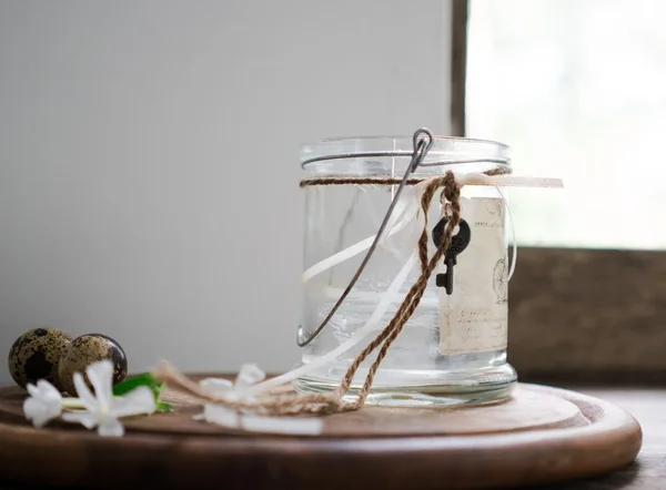 Rustic still life. glass jar, flowers. vintage, wooden background, window and fresh produce — Stock Photo, Image