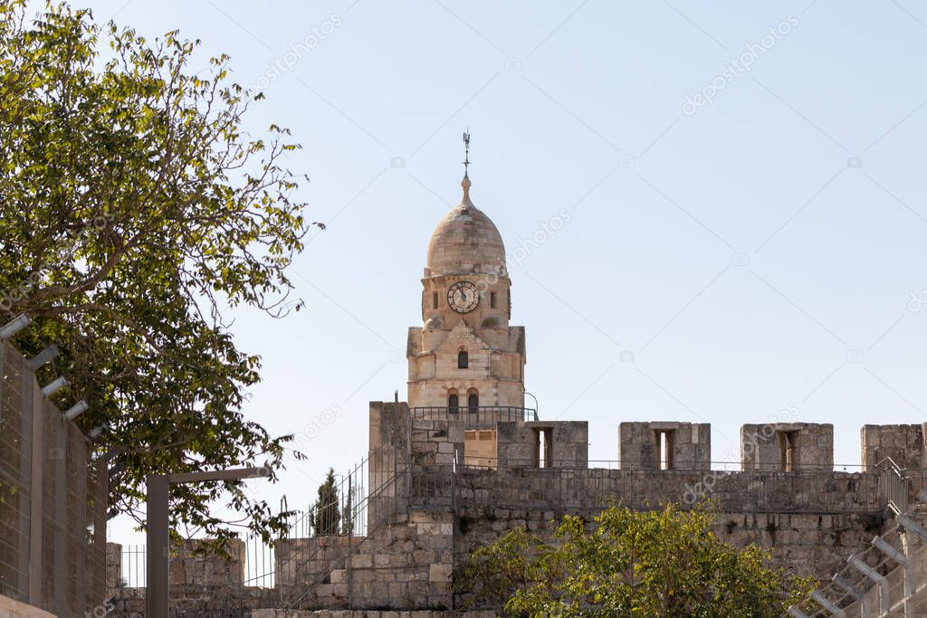 The city wall and the upper part of the Franciscan monastery near the Armenian quarter in the old city of Jerusalem, Israel