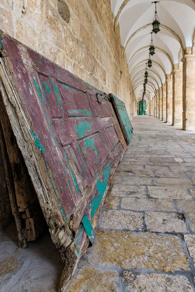 An old wooden door lies against a wall in a tunnel along the west wall on the Temple Mount, in the old city of Jerusalem, in Israel