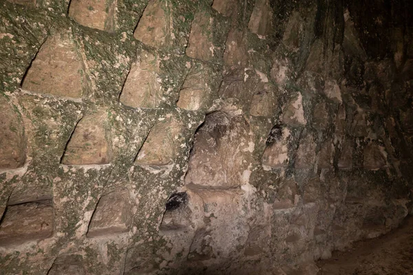 Niches for pigeons in the wall of the economic cave - columbarium - a dovecote near the excavations of the ancient Maresha city in Beit Guvrin, near Kiryat Gat, in Israel