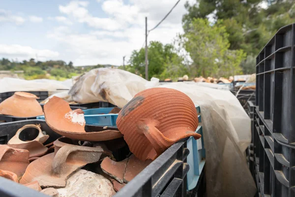 A large number of plastic boxes with fragments of pottery and jugs near the excavation in the ruins of the Maresha city, at Beit Guvrin, near Kiryat Gat, in Israel