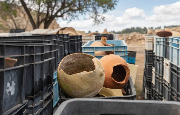 A large number of plastic boxes with fragments of pottery and jugs near the excavation in the ruins of the Maresha city, at Beit Guvrin, near Kiryat Gat, in Israel