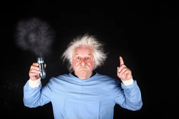 Mad scientist nutty professor is doing experiment — Stock Photo, Image