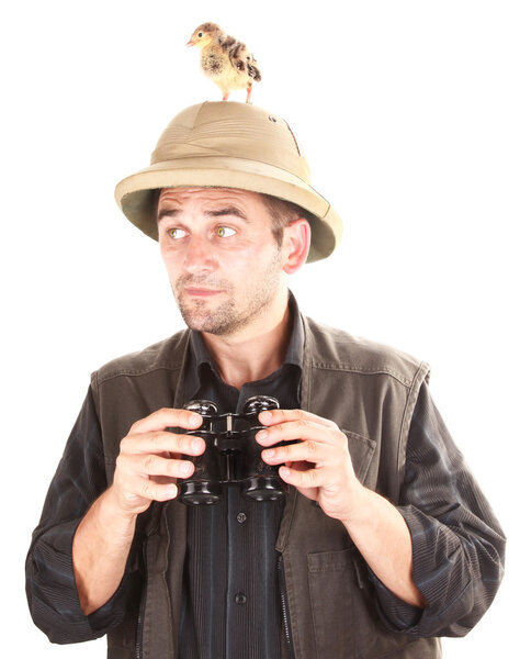 Small rare bird is hiding from birdwatcher on his head