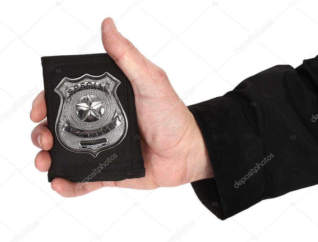 Man hand is holding special police badge