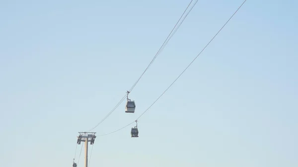 View of The Cable Car Public Transport. Cable Cars On Blue Sky Background.