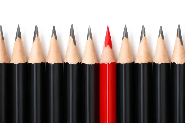 Red pencil standing out from crowd — Stock Photo, Image