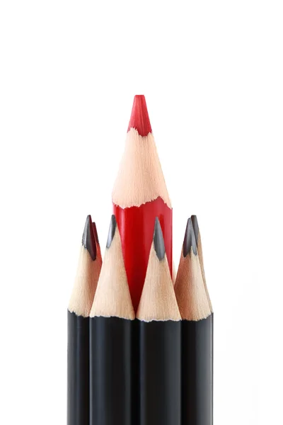 Black pencils with a red one in the middle — Stock Photo, Image