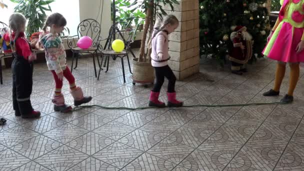 RUSSIA, St. Petersburg, January 10, 2016: little girls spend walking exercises on a rope in training the childrens room — Stock Video